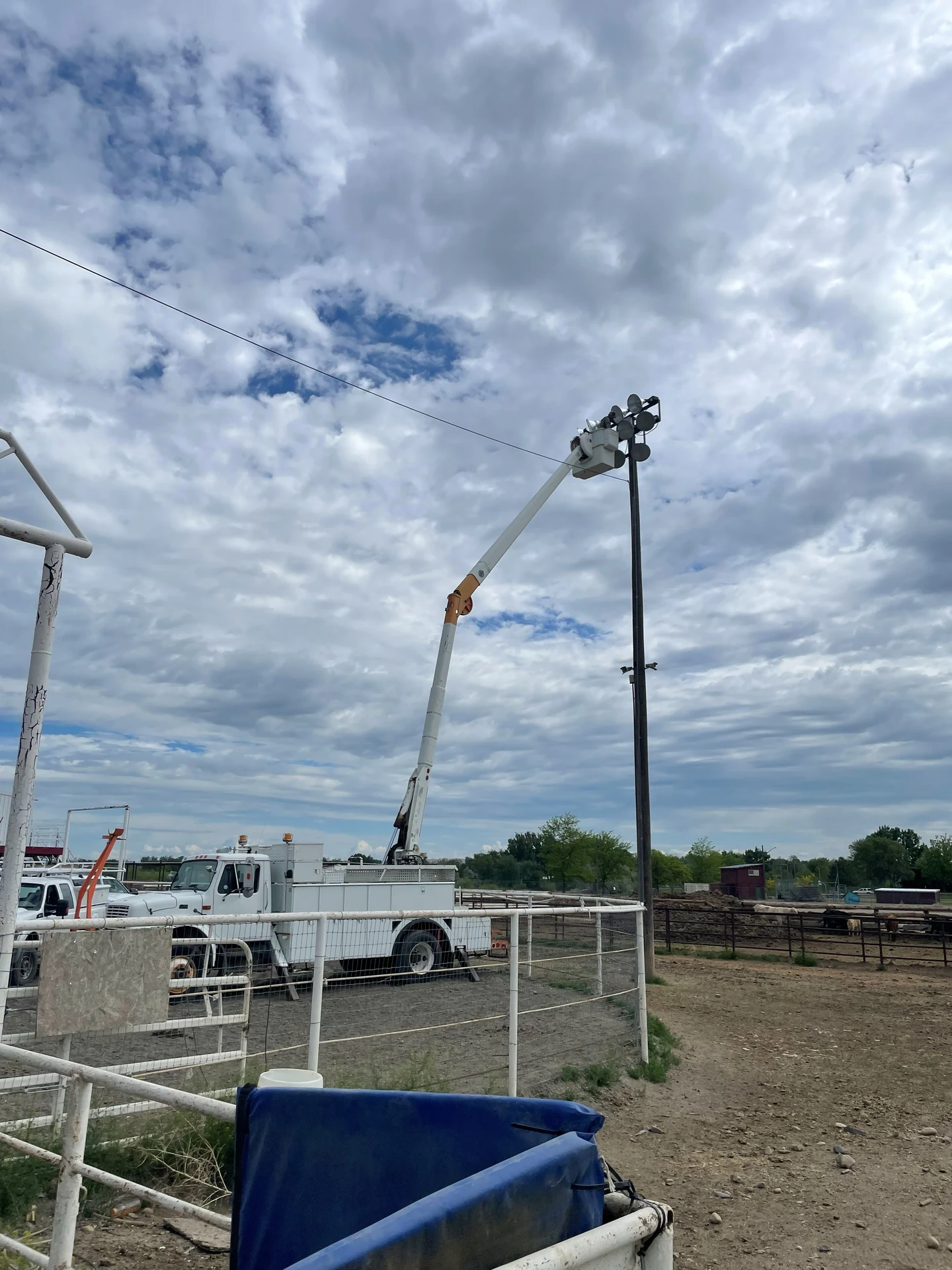 Bucket truck high mast lighting repair at outdoor arena in Ontario, OR by Campbell Electric