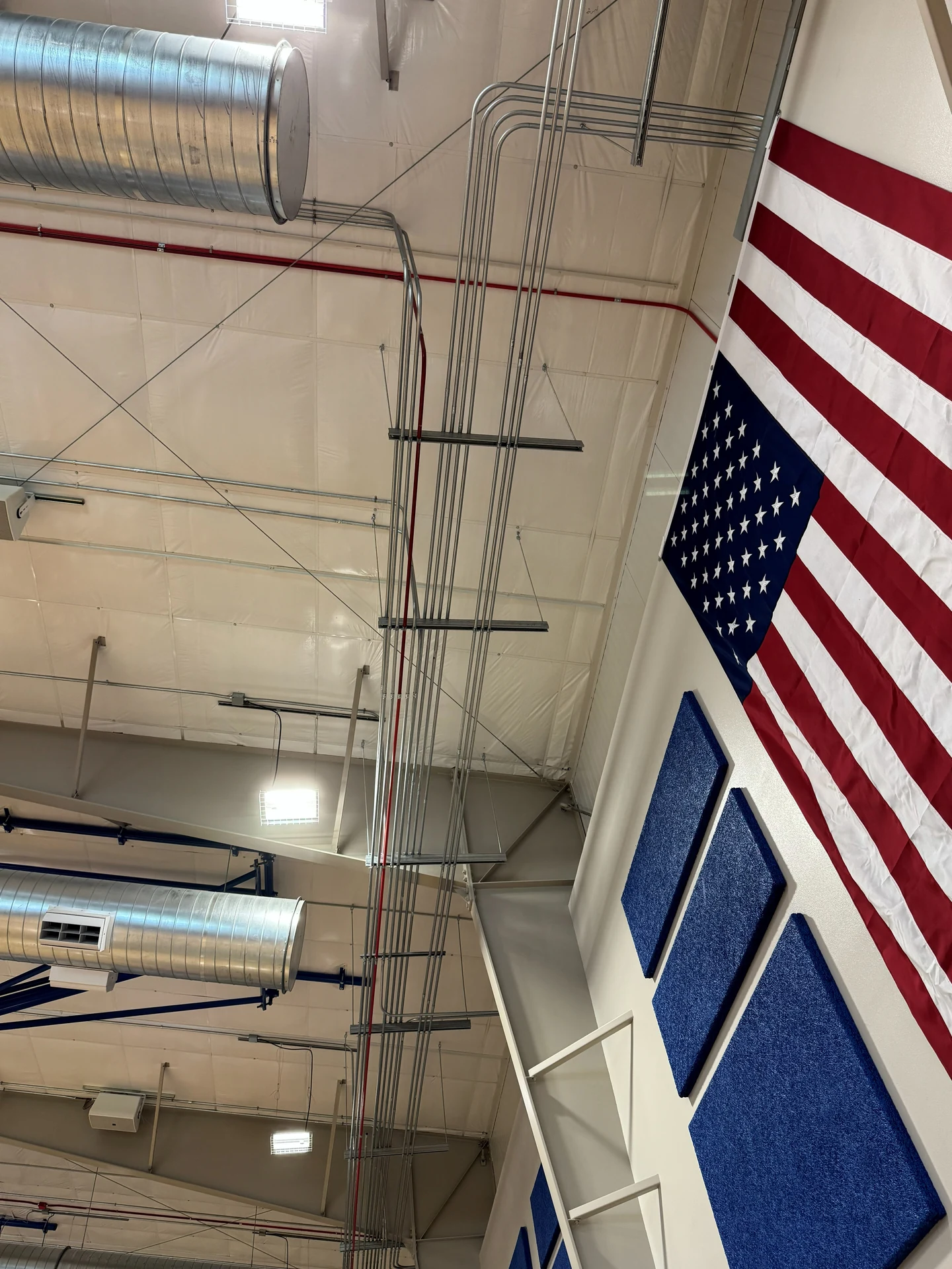 Commercial high ceiling EMT conduit and LED lighting installation in Ontario, OR by Campbell Electric