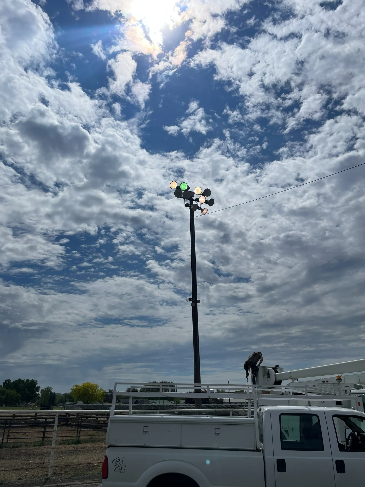 Commercial stadium light pole maintenance from bucket truck in Ontario, OR by Campbell Electric