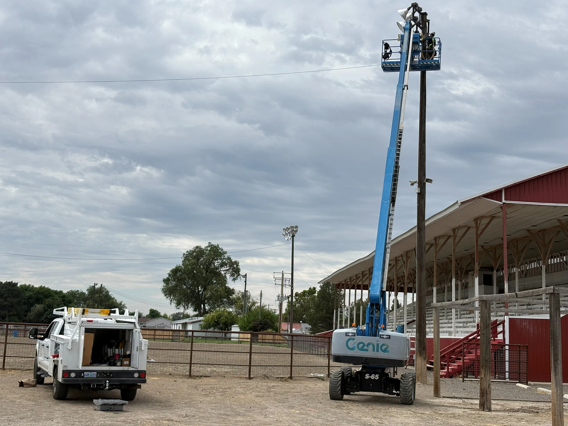 High reach commercial lighting maintenance from boom lift at fairgrounds in Ontario, OR by Campbell Electric